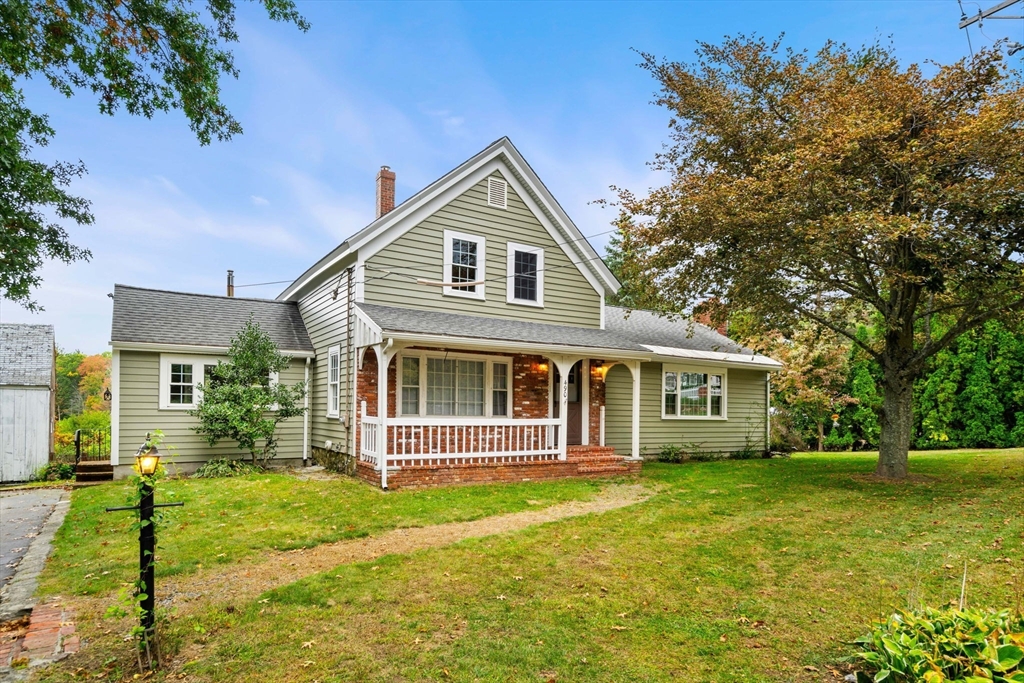 a front view of a house with a yard