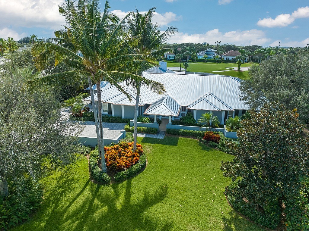 a aerial view of a garden with plants and large trees