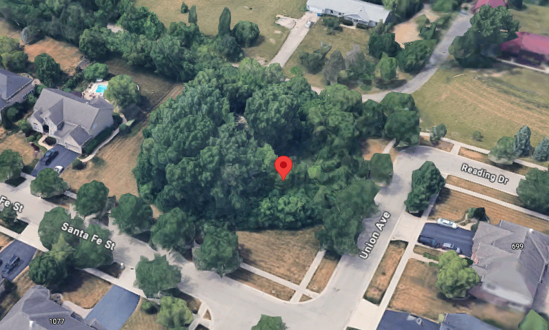 an aerial view of residential house with outdoor space and swimming pool