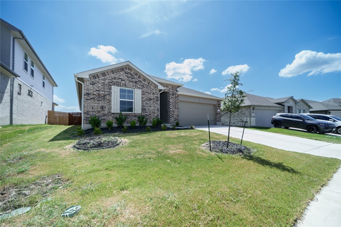 a front view of a house with a yard