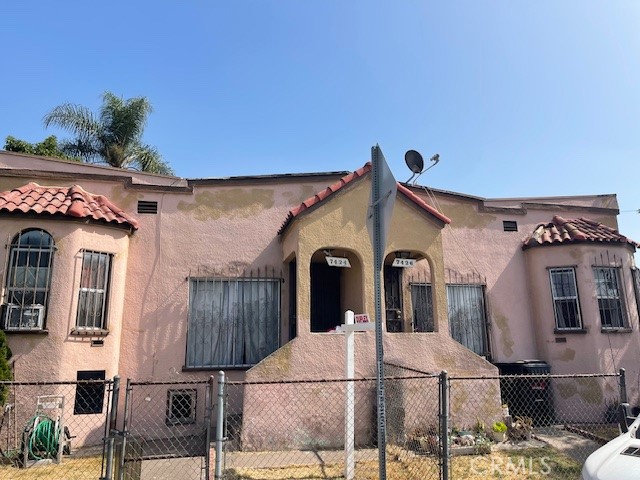 a view of a building with a yard