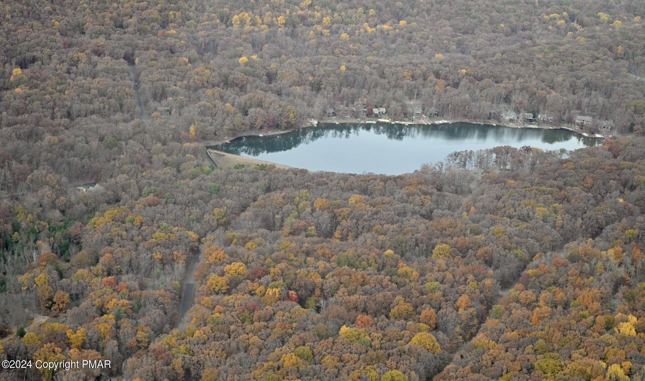 a view of a lake with a yard