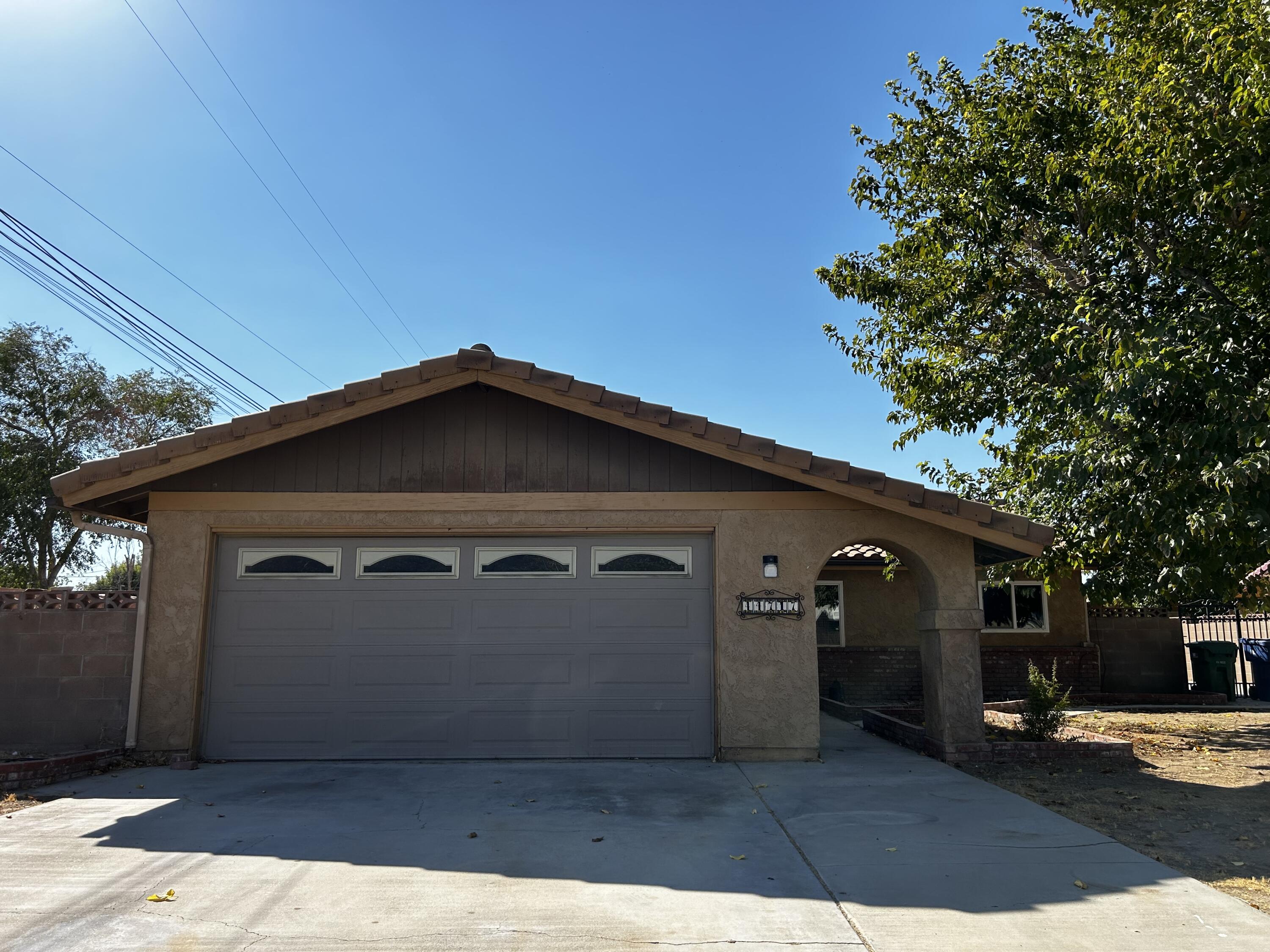 a front view of a house with a garage