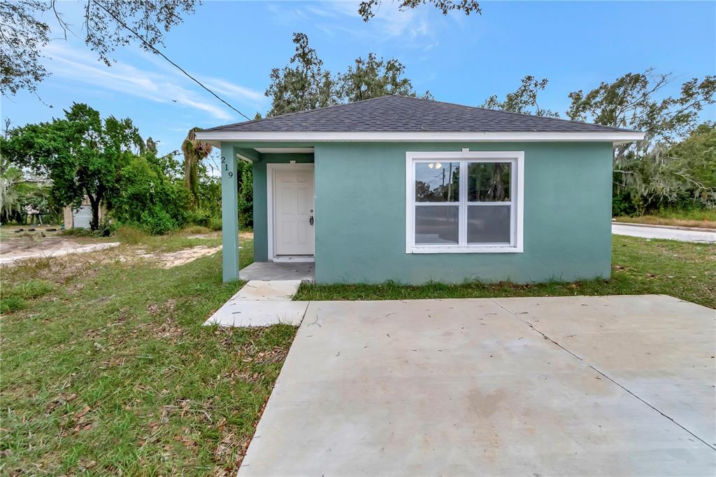 front view of a house with a yard