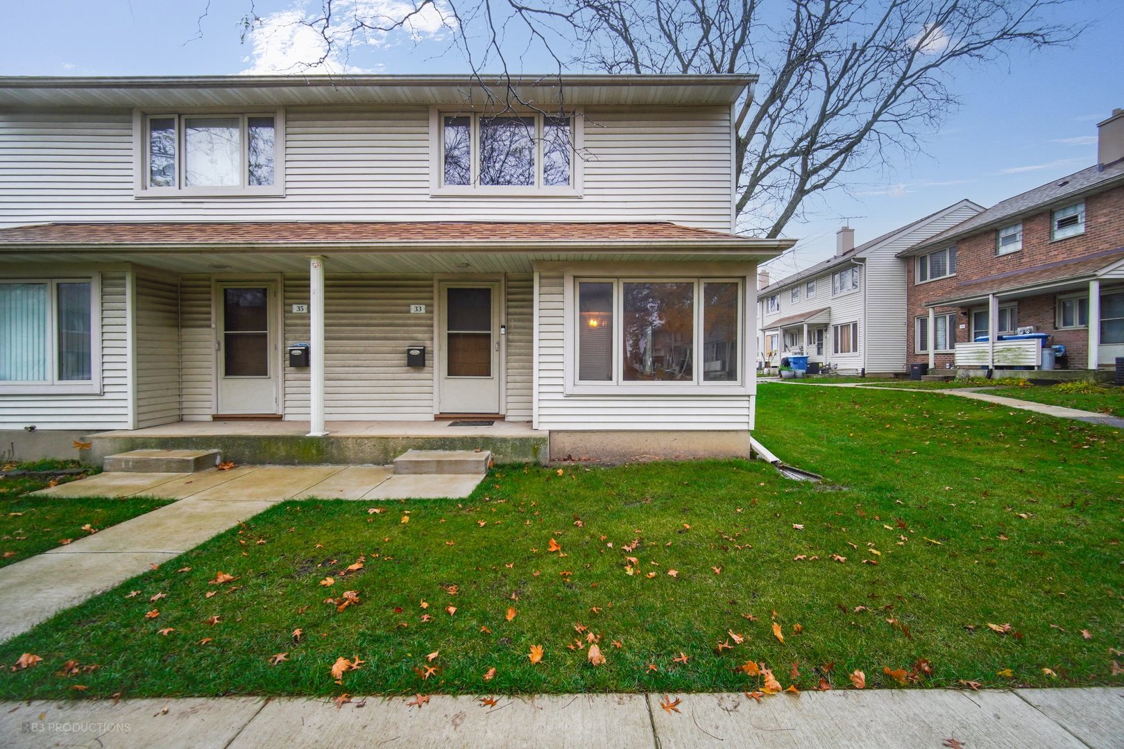 a view of a house with a yard porch and sitting area