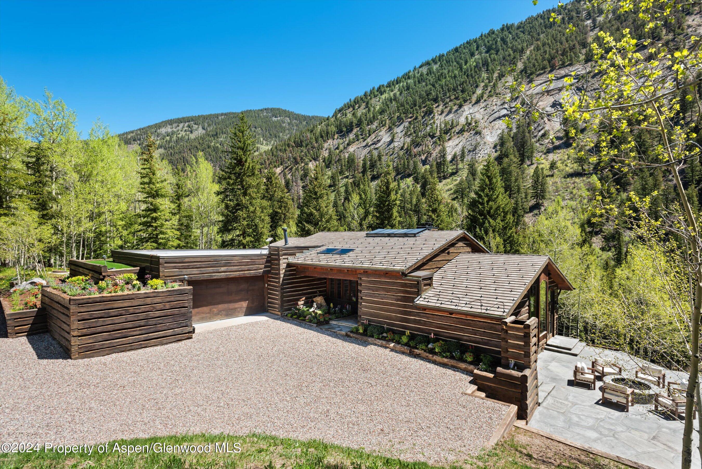 a view of a backyard with sitting area