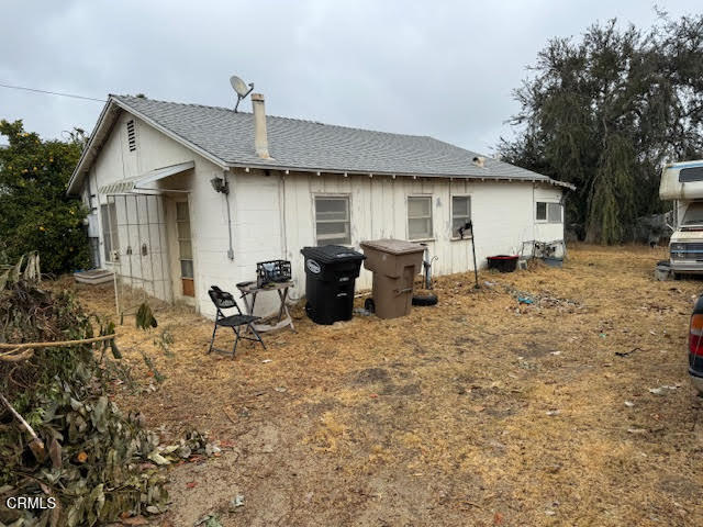 a front view of a house with outdoor seating