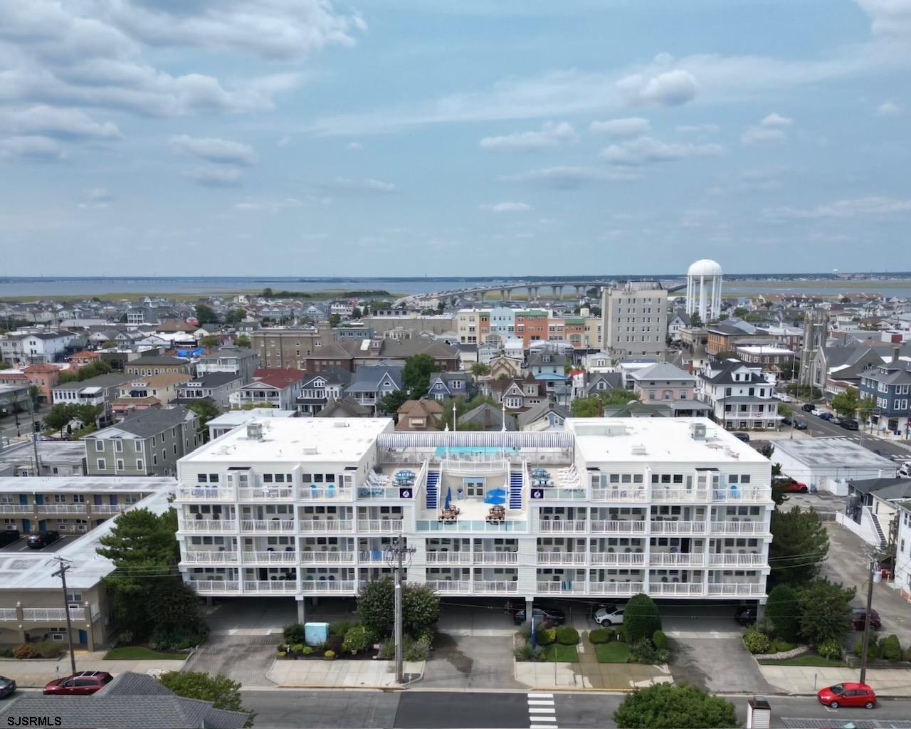 a view of a large building with a city street