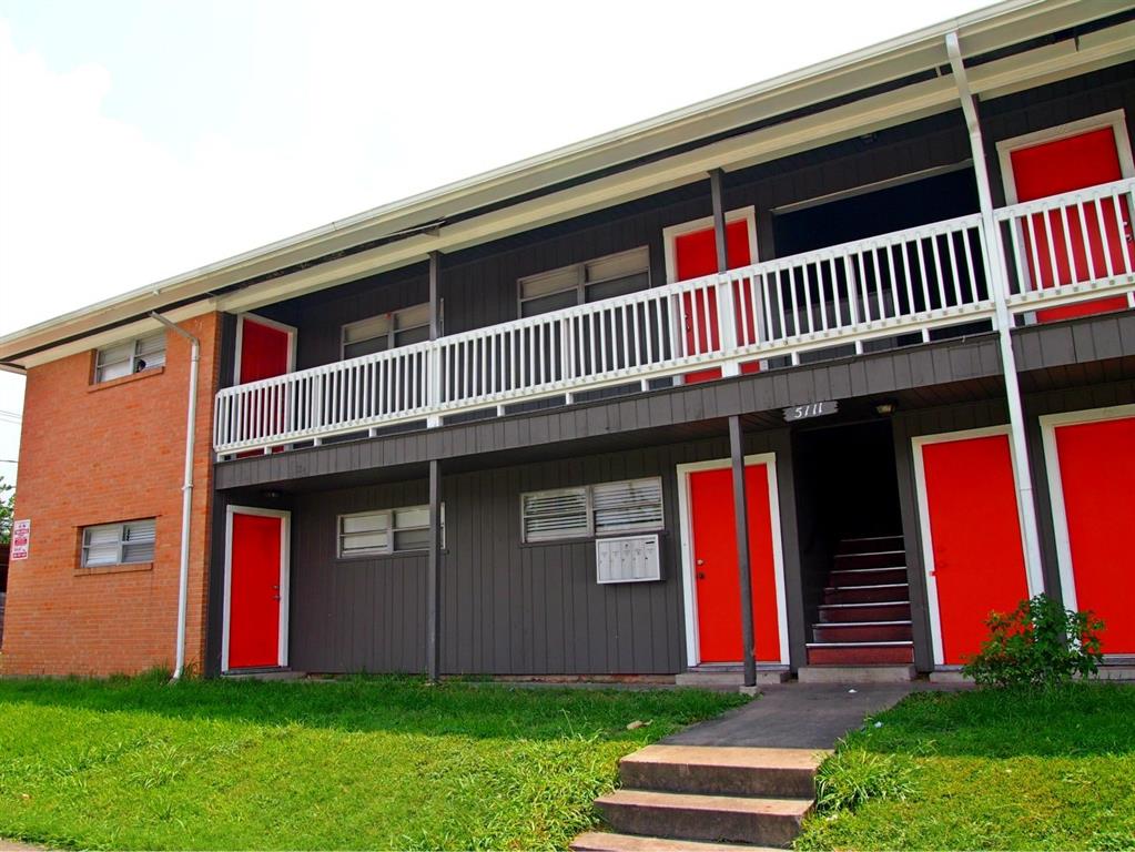 a front view of building with yard