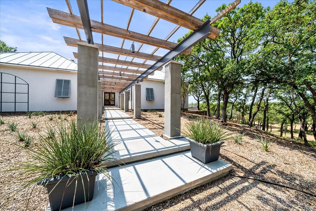 a view of a backyard with sitting area