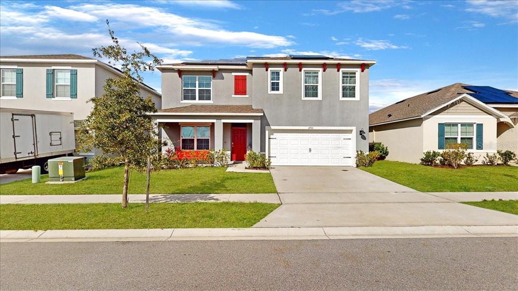 a front view of a house with a yard