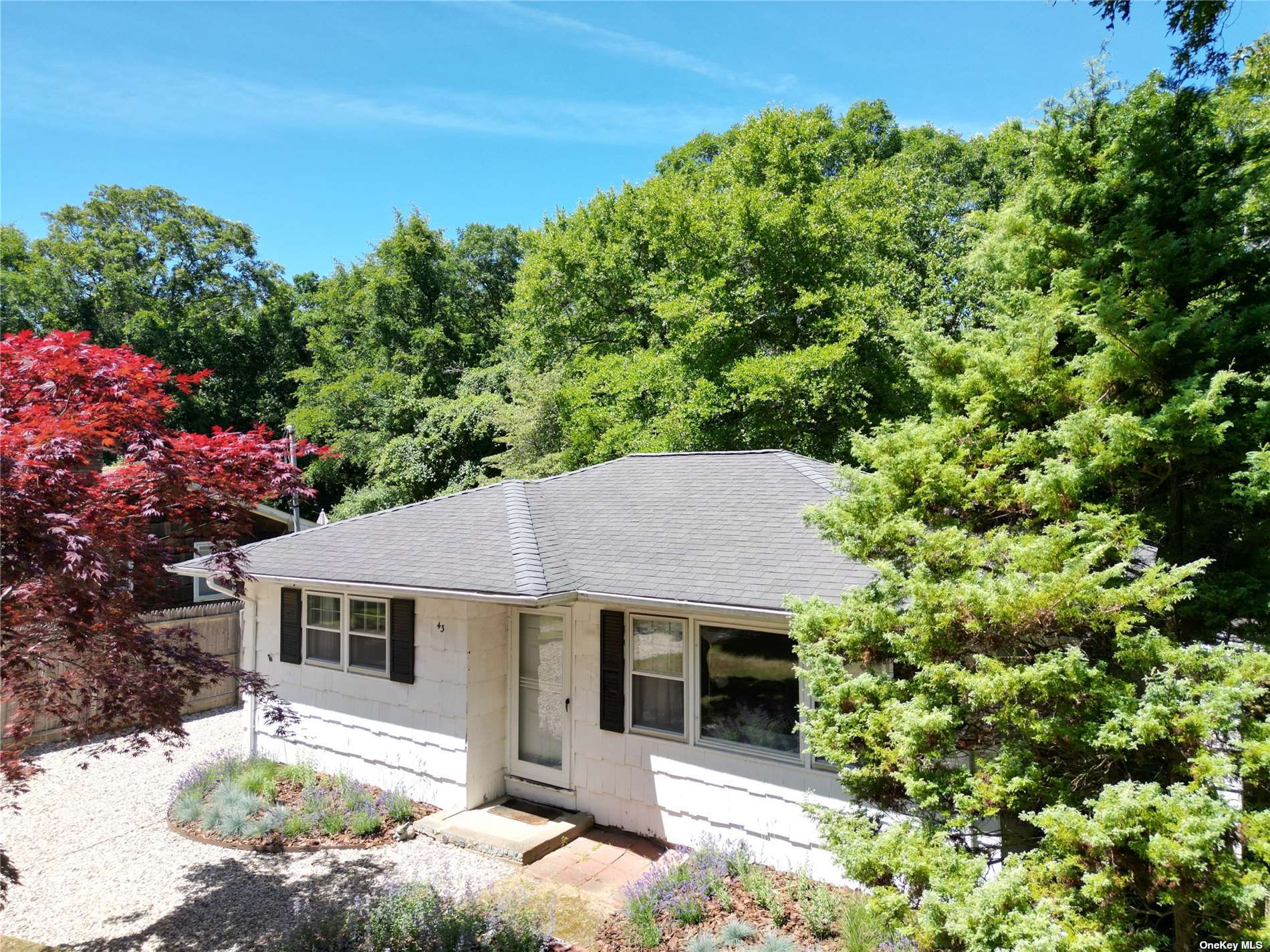 a house with trees in the background