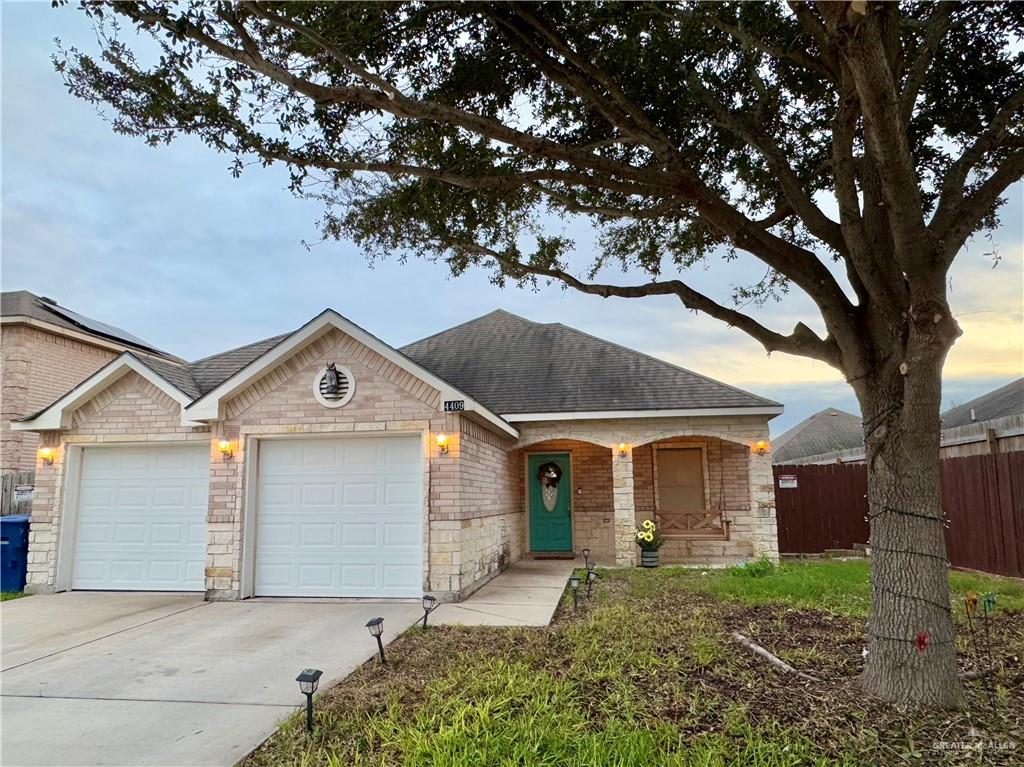 Single story home featuring a garage