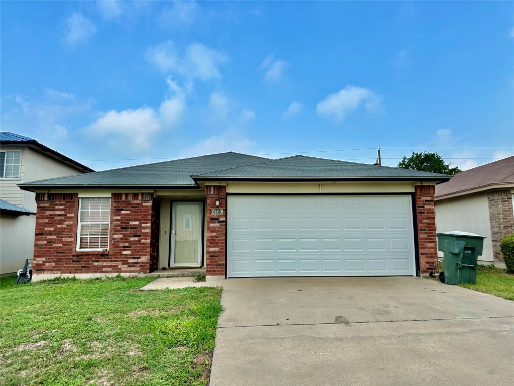 front view of a house with a yard