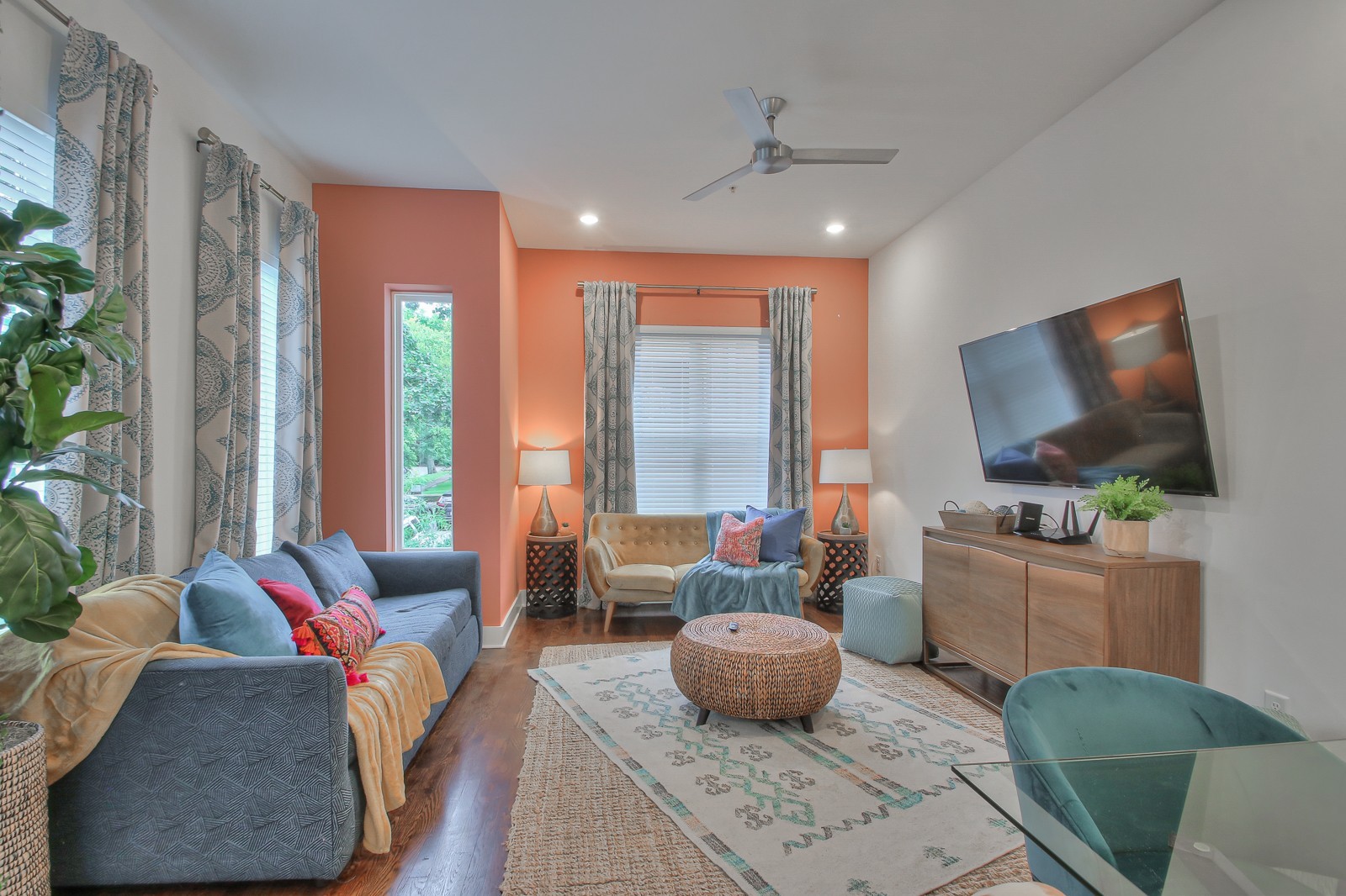 a living room with furniture and a flat screen tv