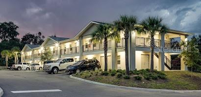 a couple of cars parked in front of a house