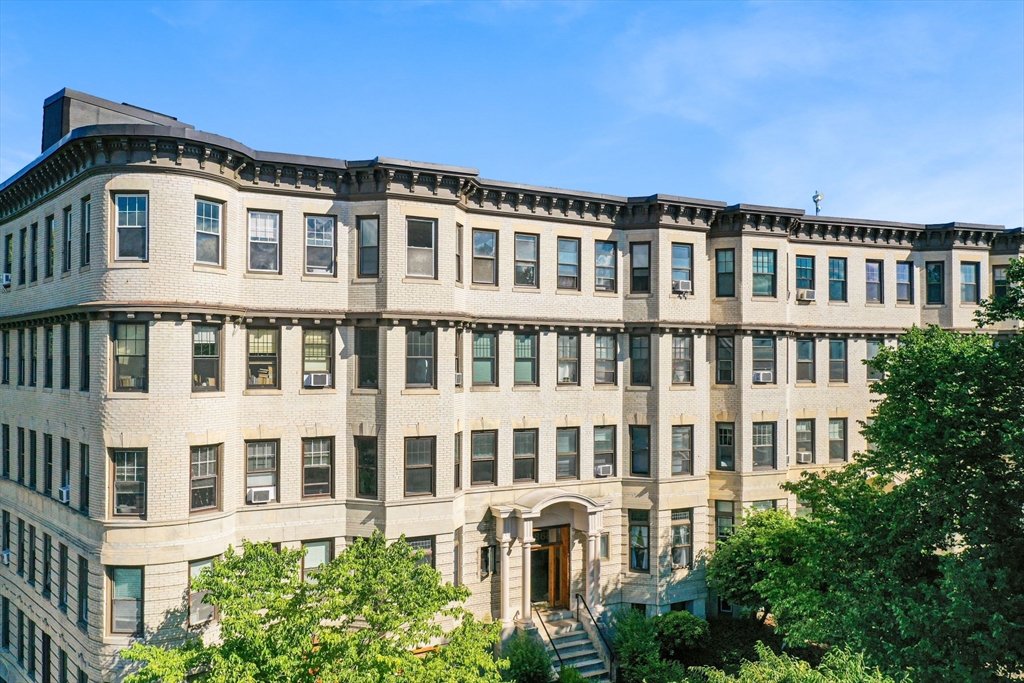 a front view of a building with a lot of windows