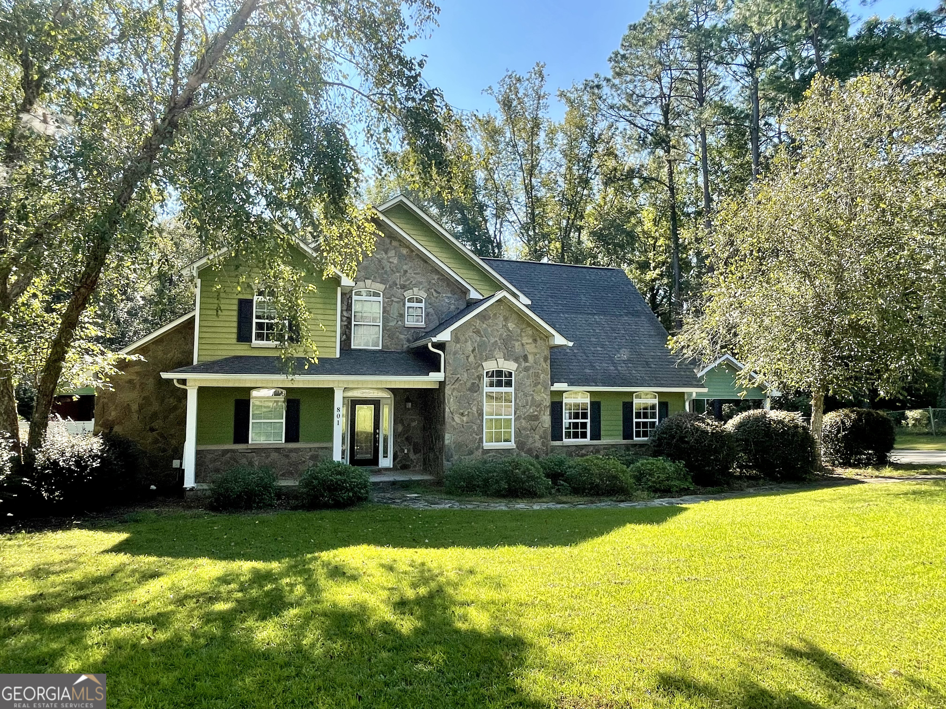 a front view of a house with swimming pool