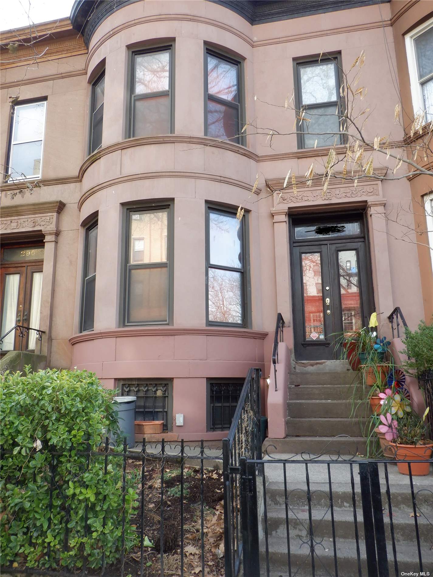 a front view of a house with a lots of windows