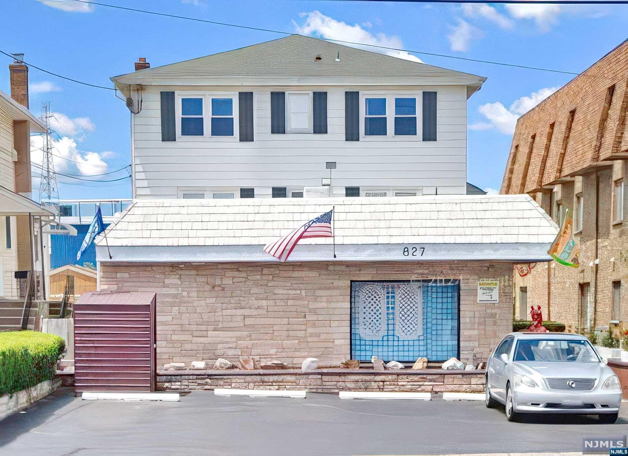 a front view of a house with a garage