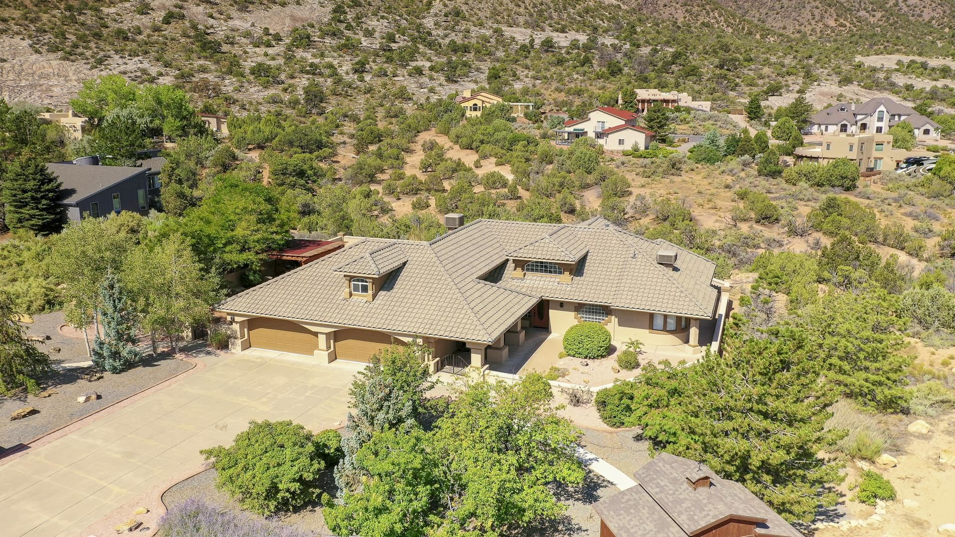 an aerial view of a house with yard