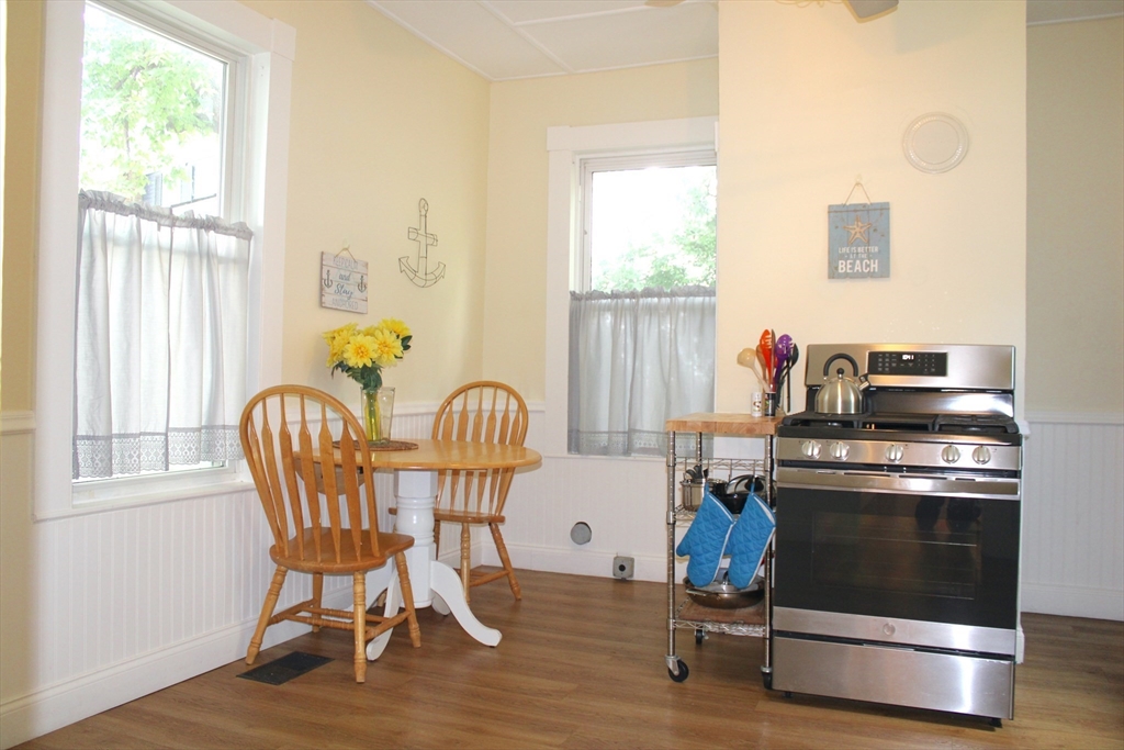 a dining room with furniture and windows