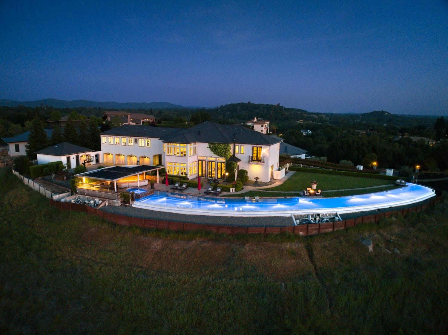 a view of a swimming pool with an outdoor space and seating area