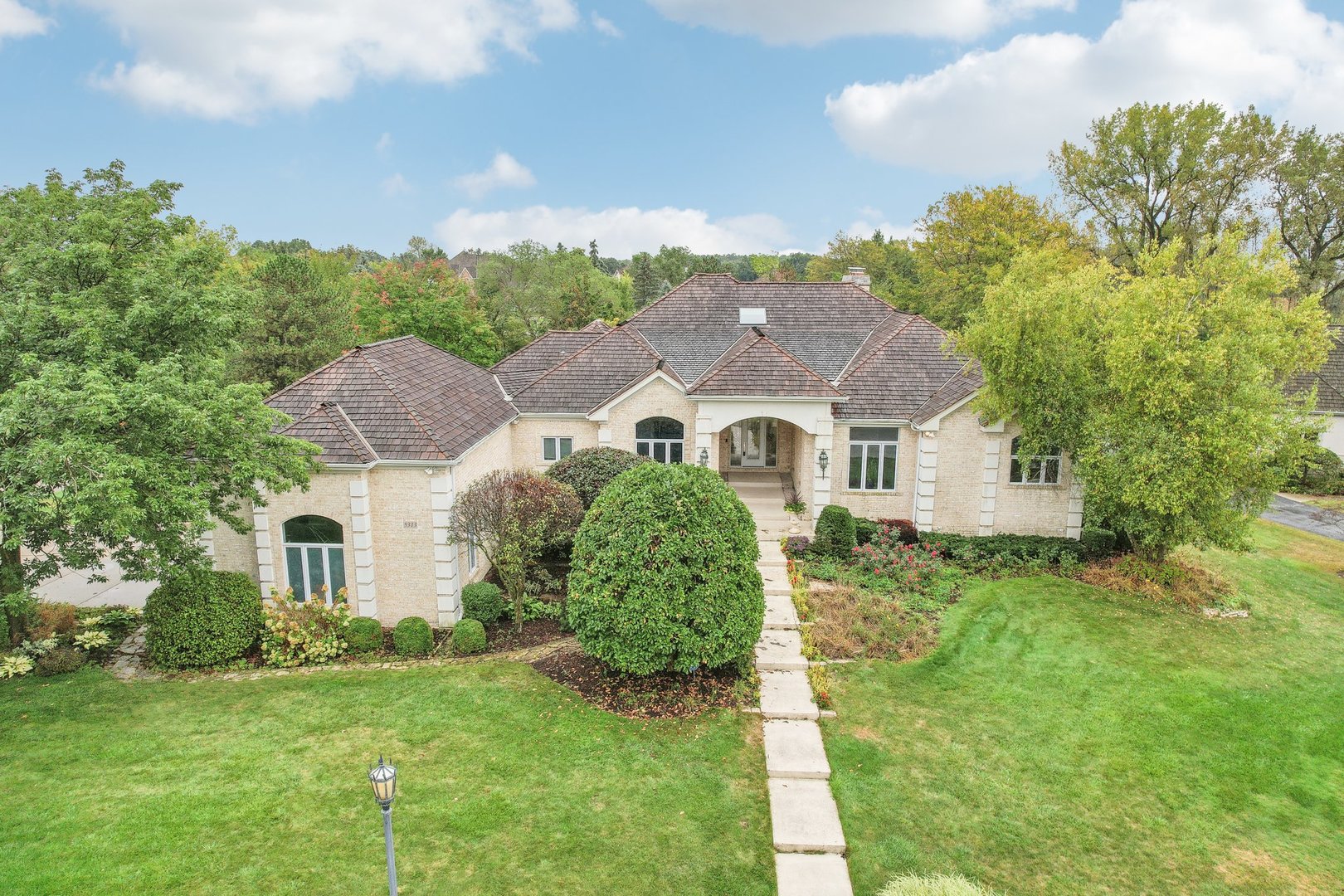 a aerial view of a house with a yard