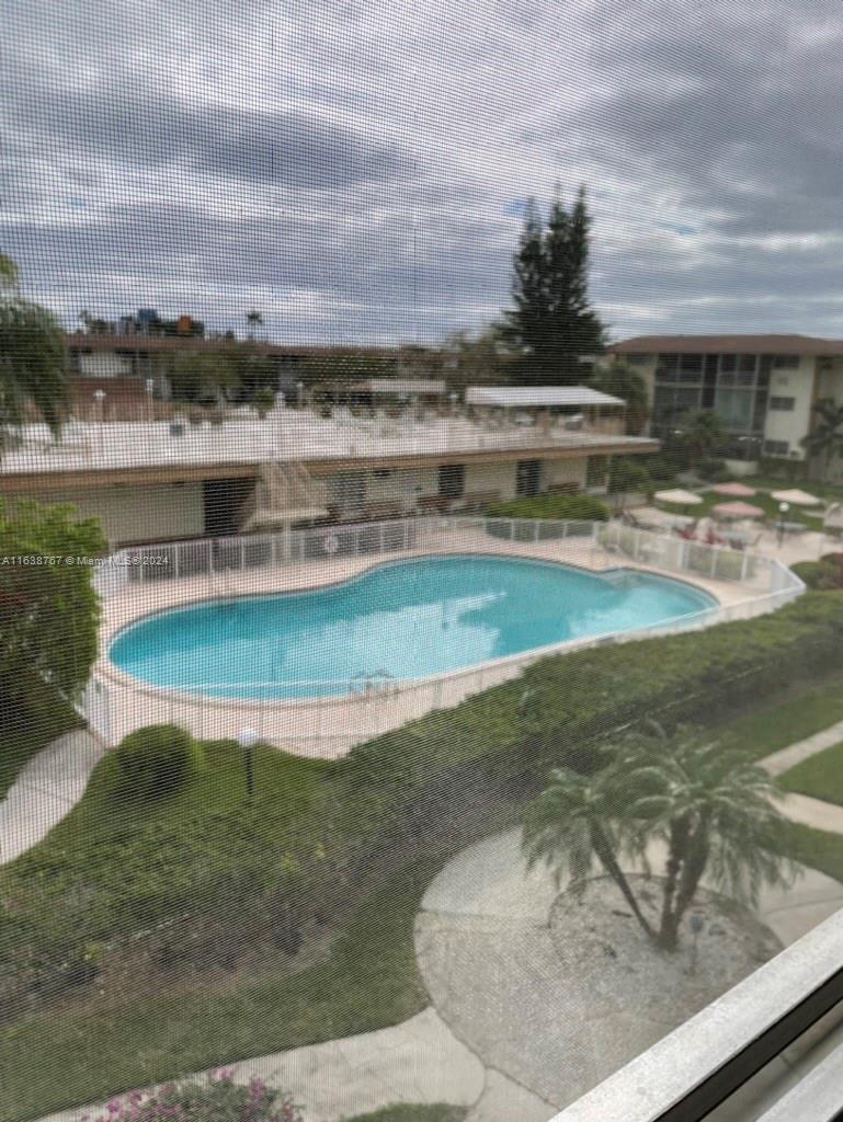 a view of a swimming pool with an ocean view