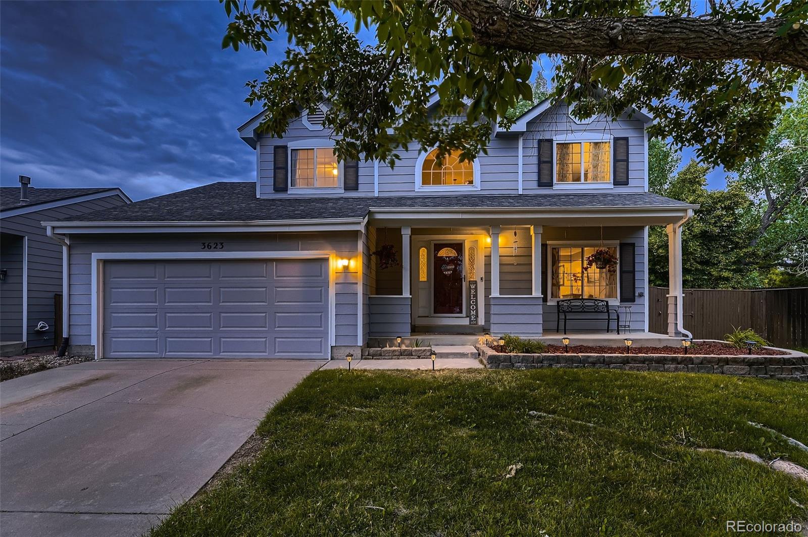 front view of a house with a yard