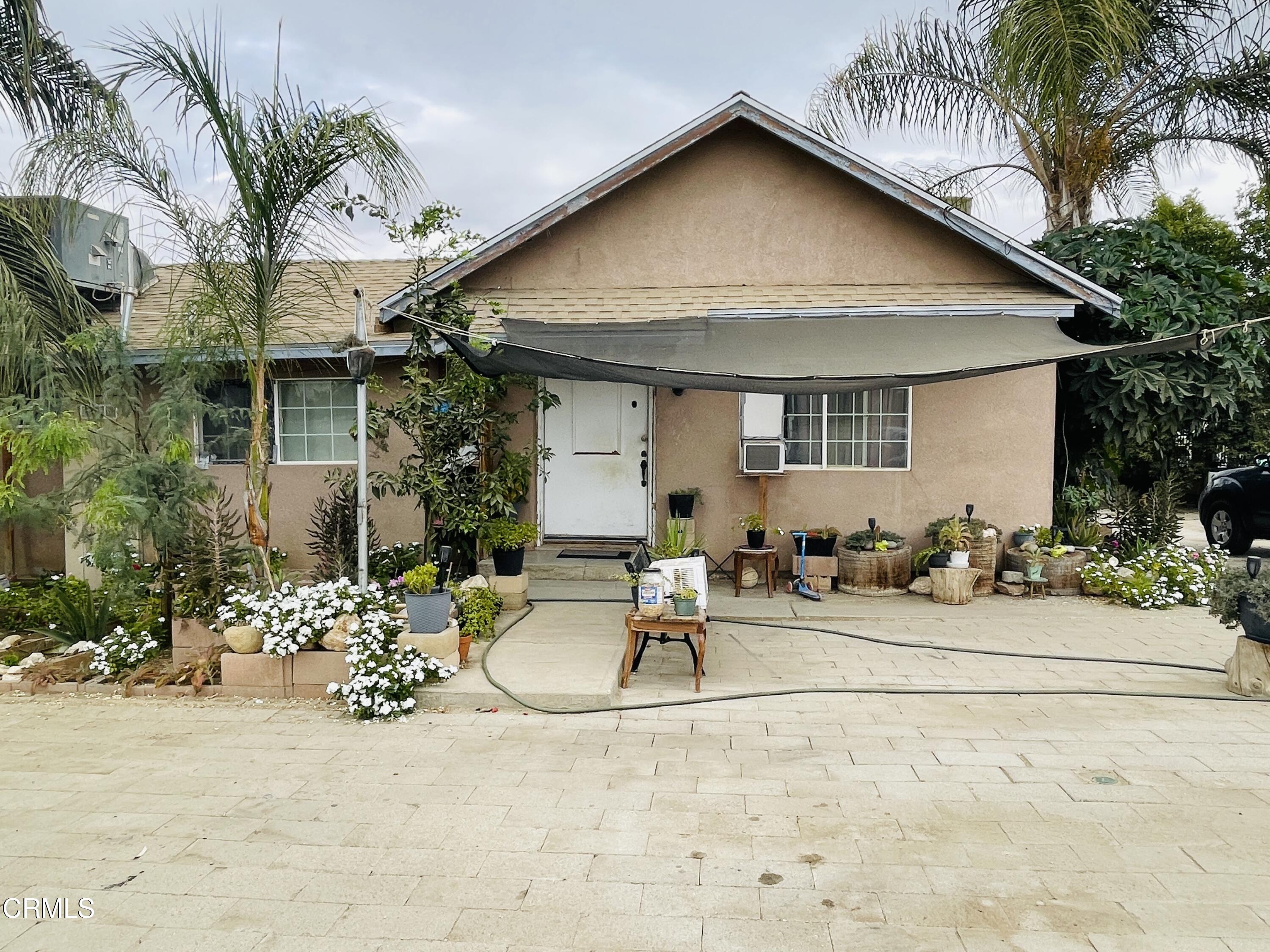 a front view of a house with a patio