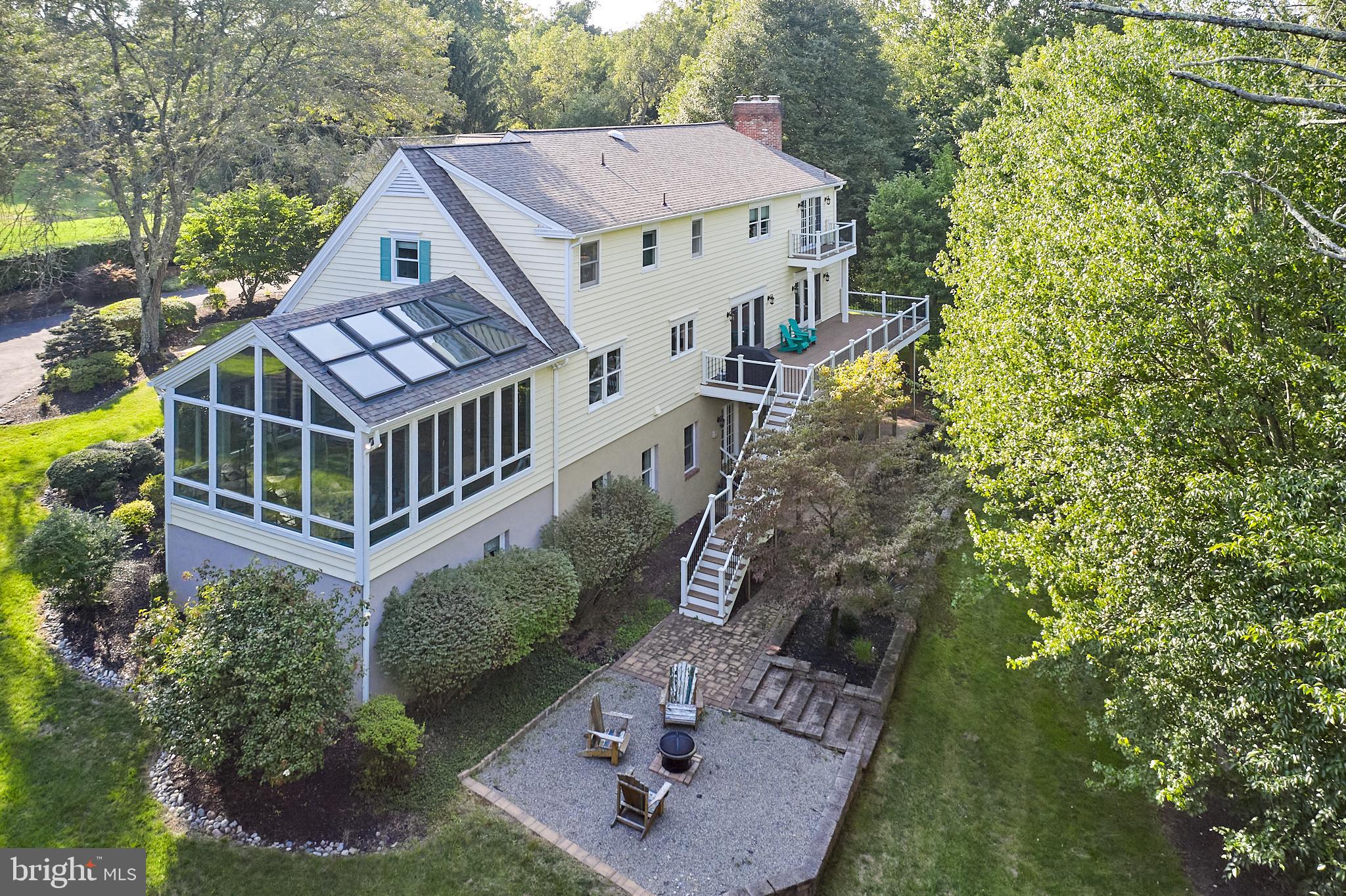 a aerial view of a house with a yard