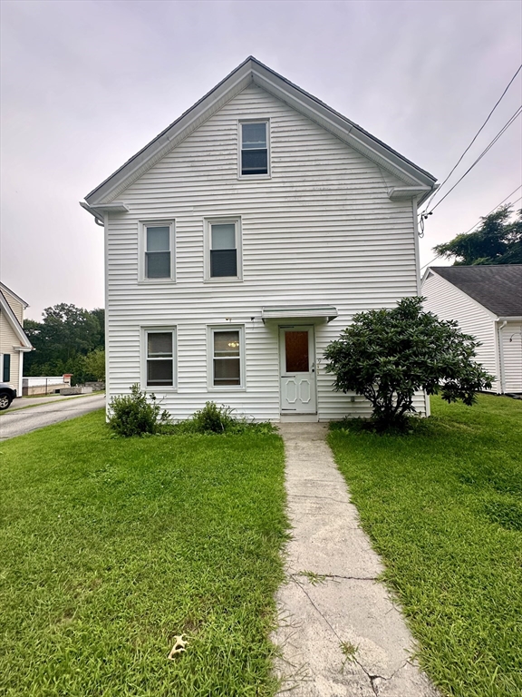 a front view of house with yard