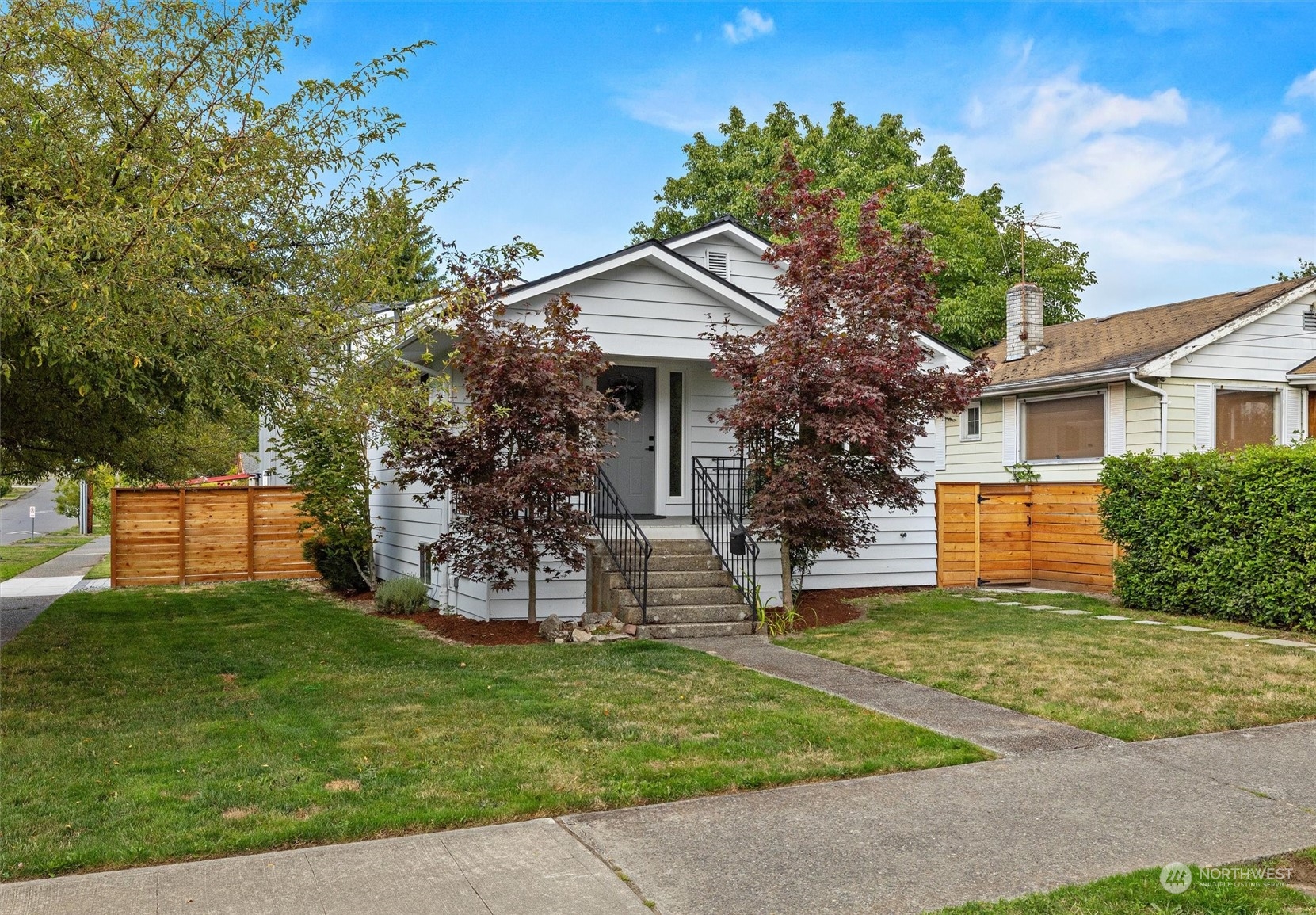 front view of a house with a yard