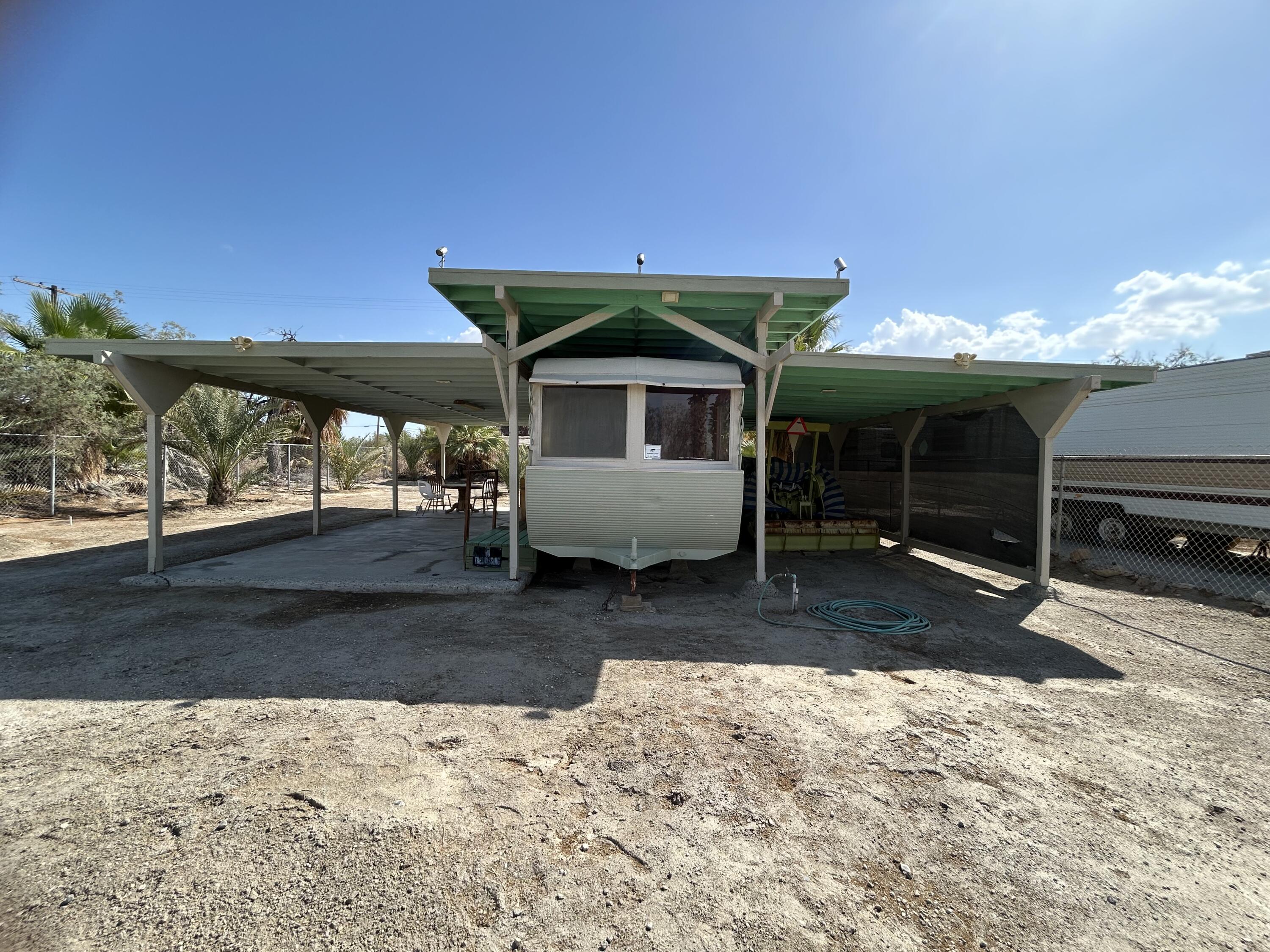 a view of a house with a yard and roof