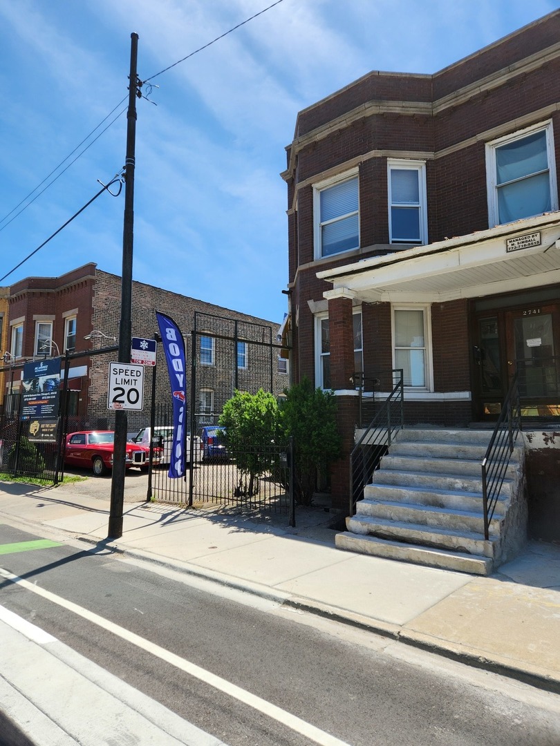 a view of a building with a street