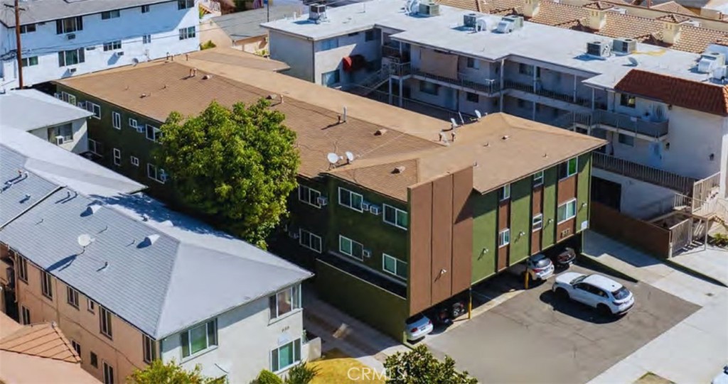 an aerial view of a house with roof deck