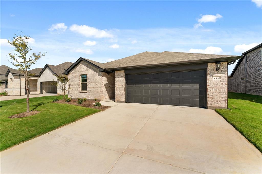 a front view of a house with garage