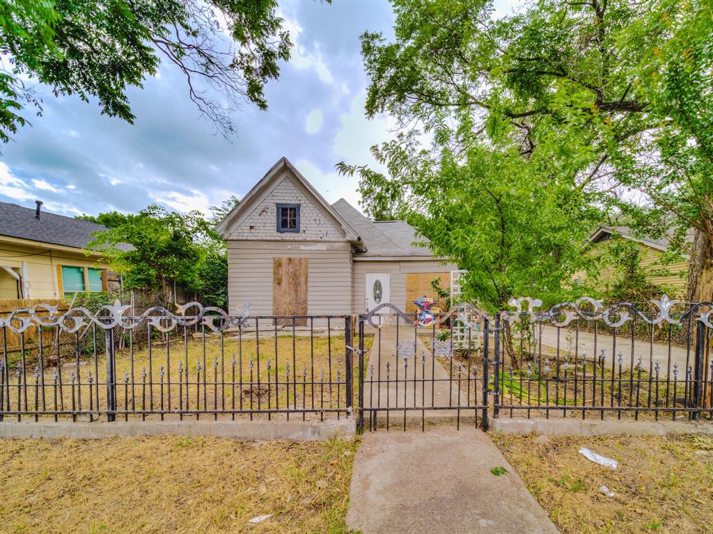 a front view of a house with a fence