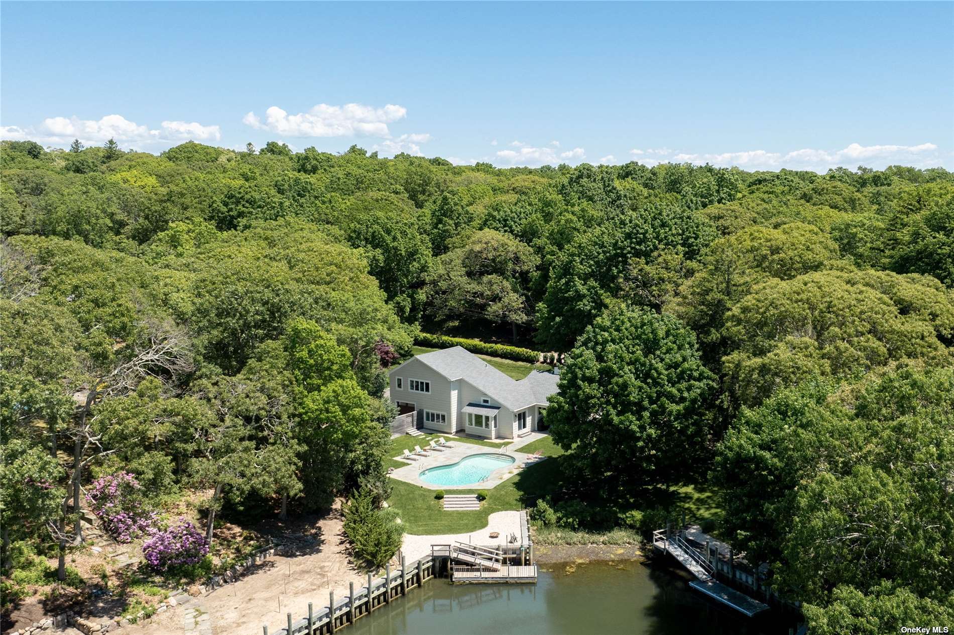 a aerial view of a house with a yard