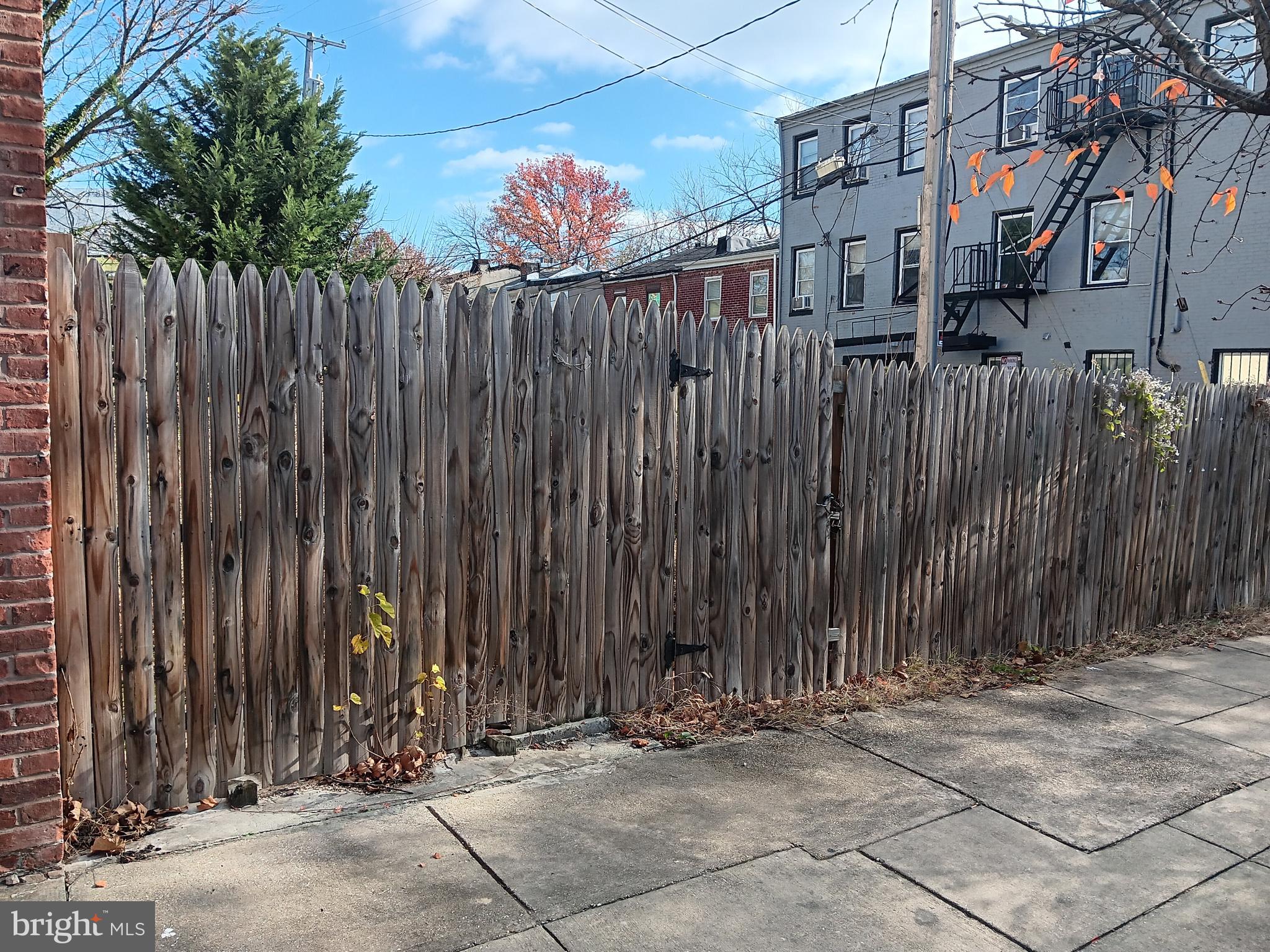 a view of a house with a fence