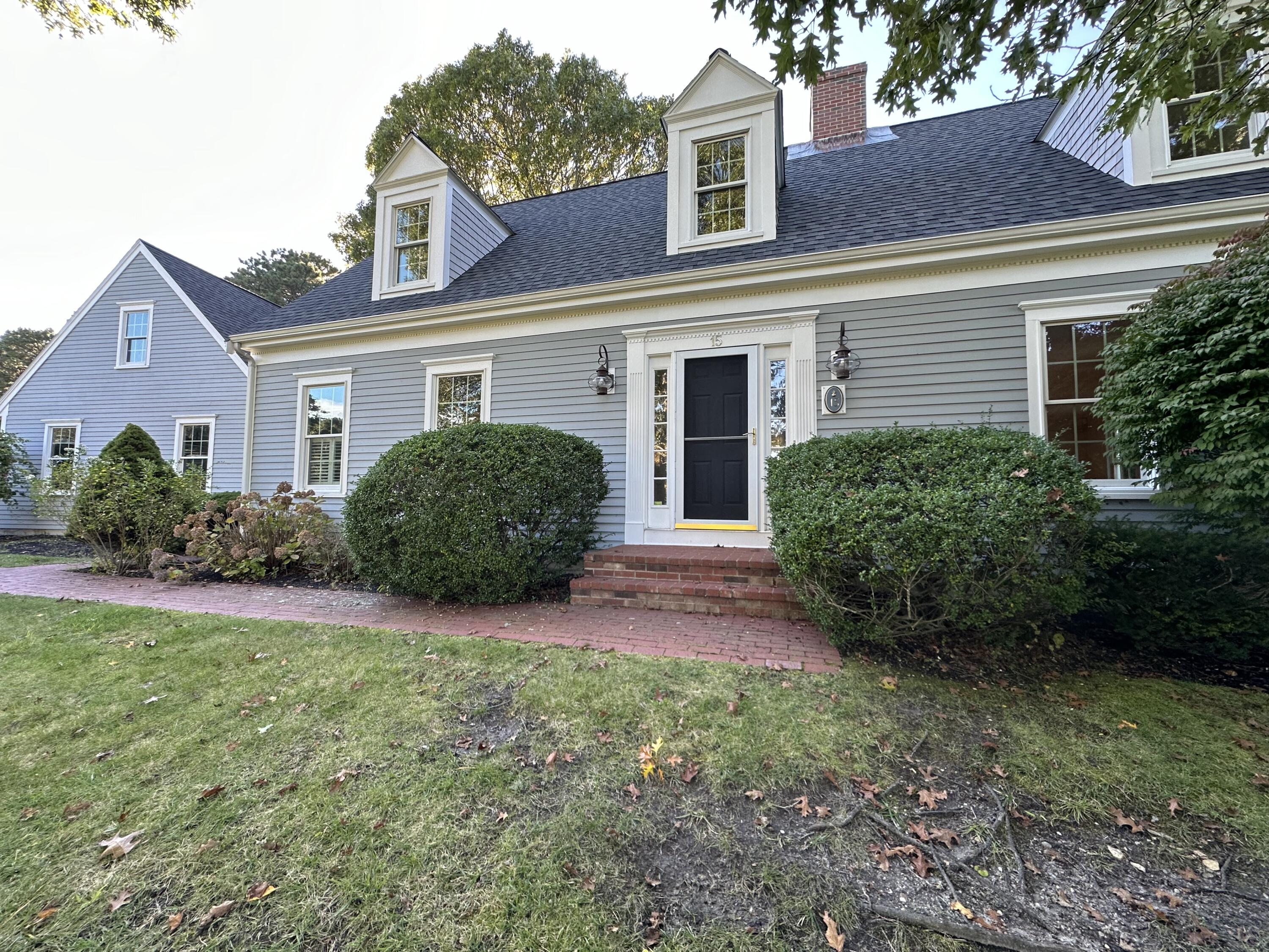 front view of a house with a yard