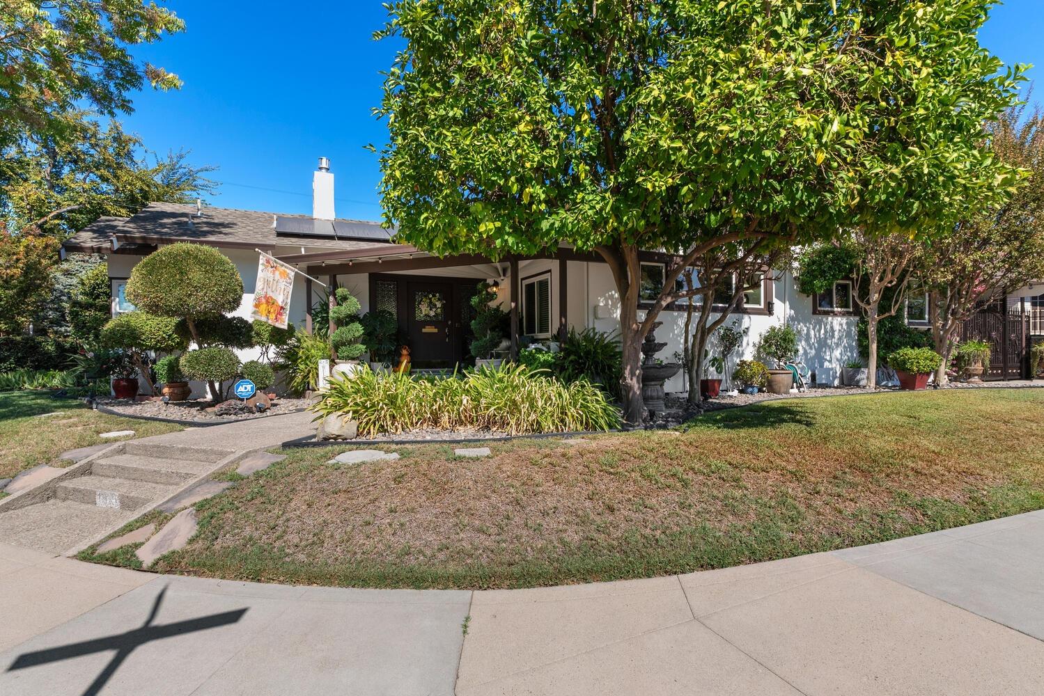 a front view of a house with garden