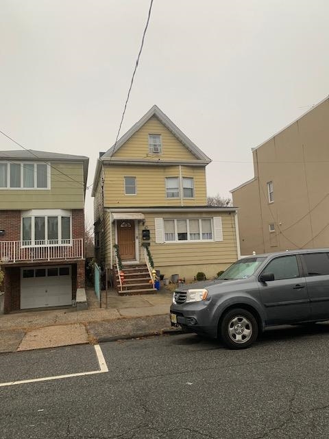 a car parked in front of a house