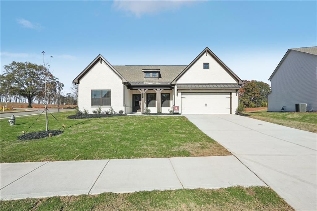 front view of a house with a yard