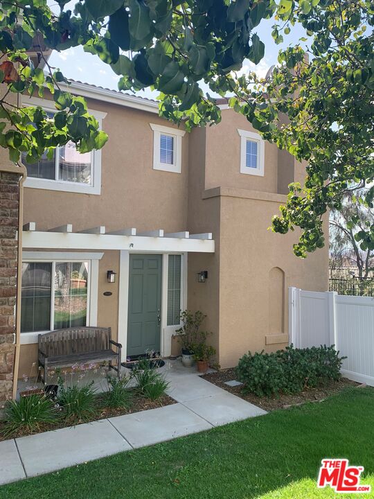 front view of a house and a yard