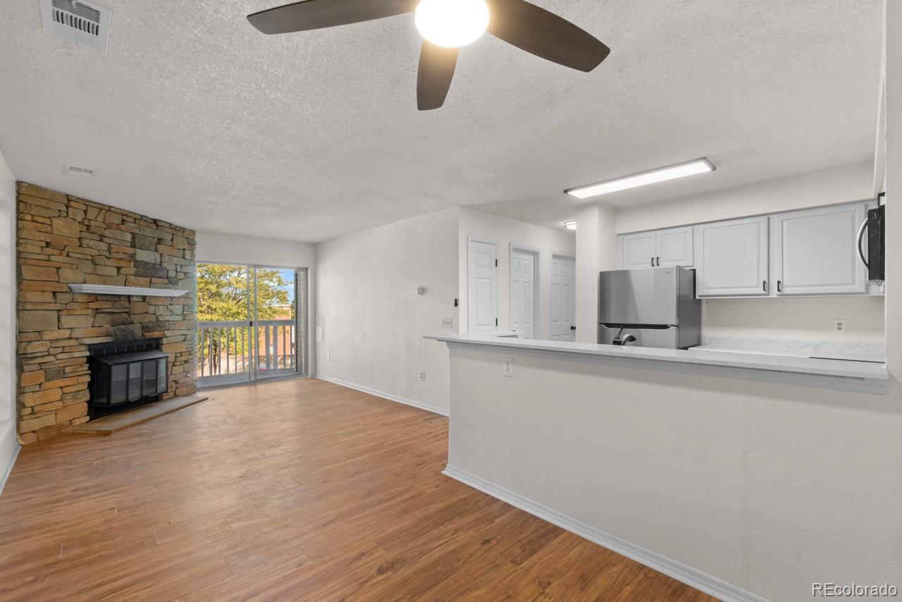 a kitchen with stainless steel appliances a refrigerator sink and stove top oven