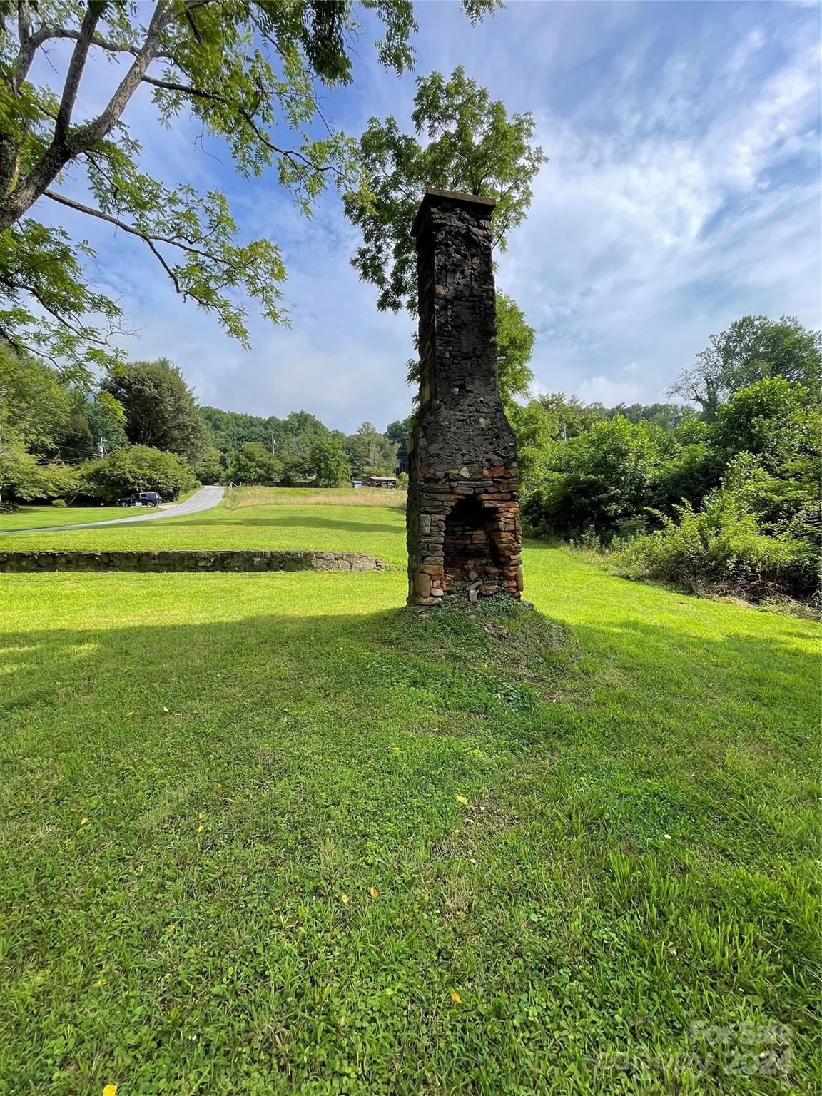 a view of a garden with a building in the background