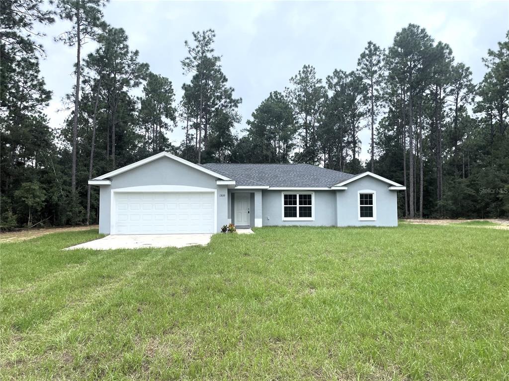 a front view of a house with yard