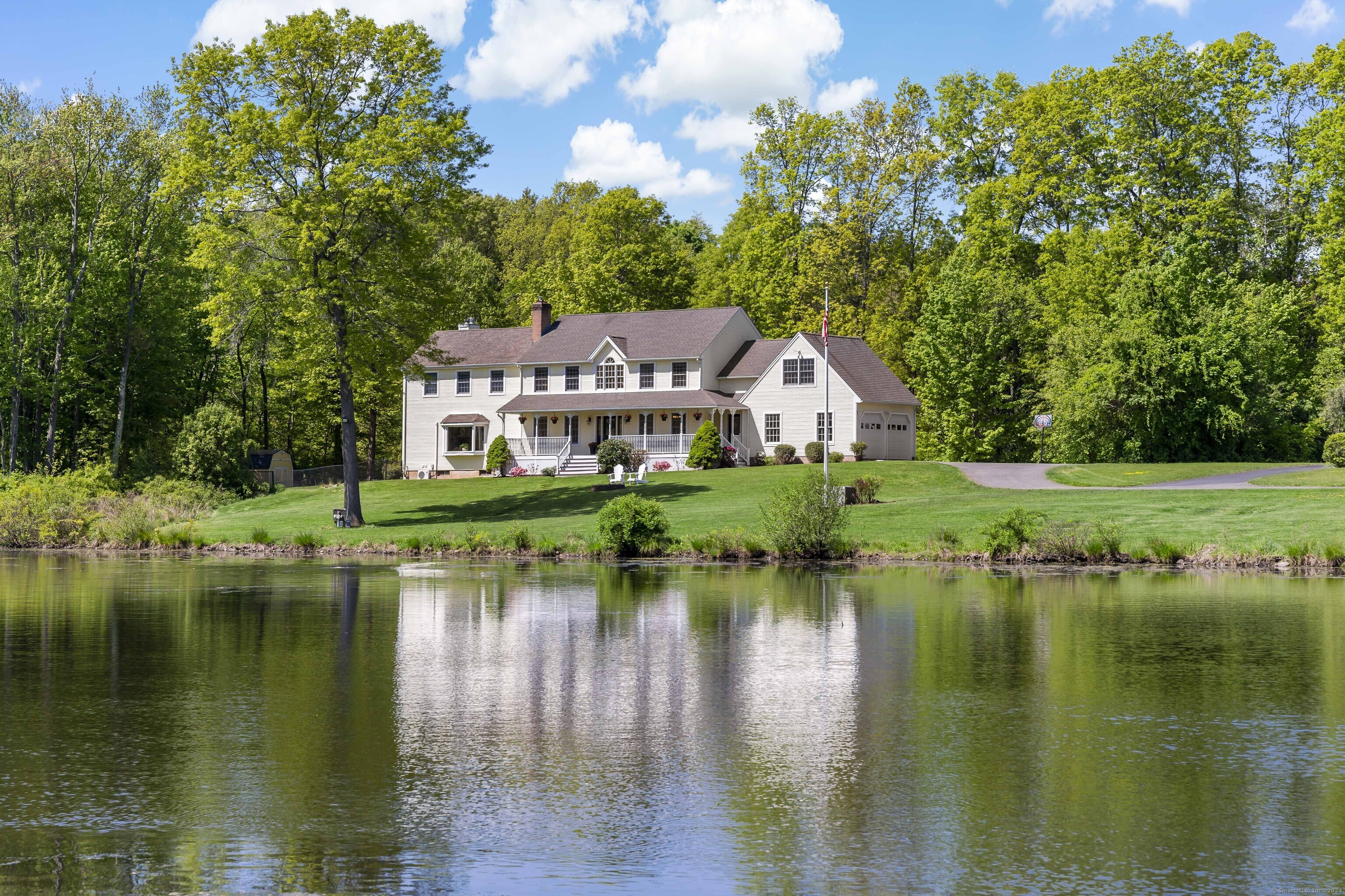 a aerial view of a house with a lake view